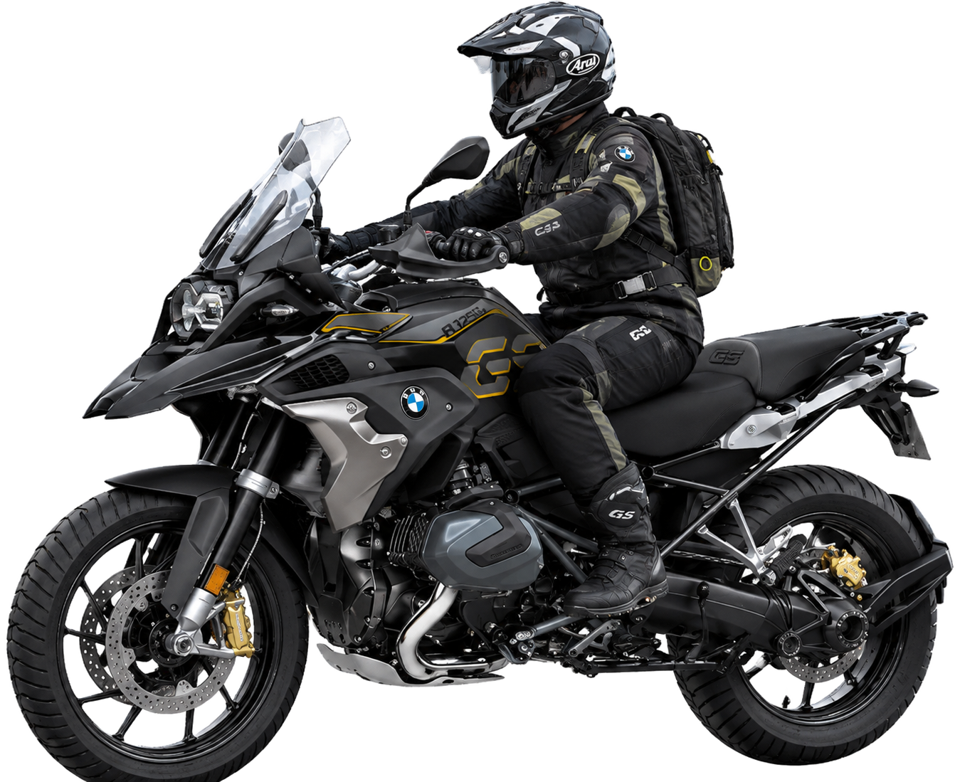 BMW R 1250 GS preta com detalhes dourados, com piloto